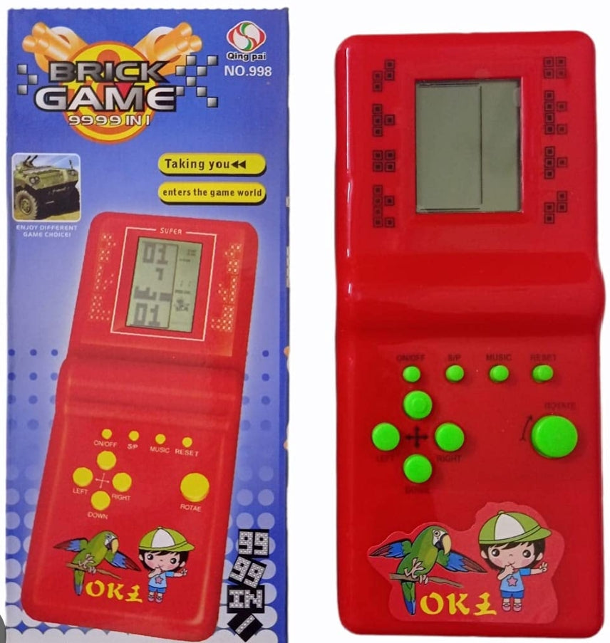 Red handheld electronic game with green buttons and colorful packaging on a white background
