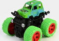 Toy monster truck with green and black design on a white background