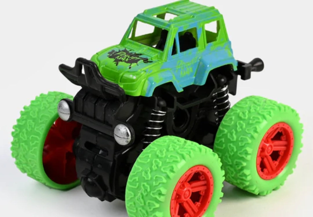 Toy monster truck with green and black design on a white background