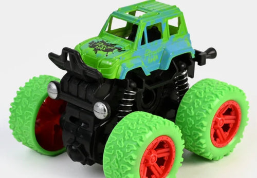 Toy monster truck with green and black design on a white background